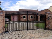Gate 40 automated decorative  wrought iron gate with underground hydraulic gate automation, vertical saftey edges and GSM intercom. Moss Doncaster 